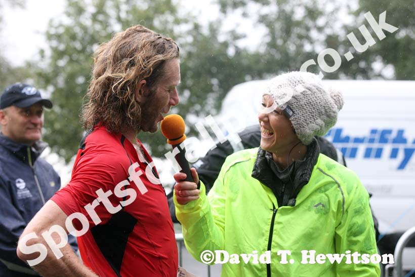 Allison Curbishley interviews Ceri Rees after his victory in the Kielder Marathon. Photo: David T. Hewitson/Sports for All Pics
